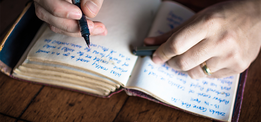 Woman writing in her journal