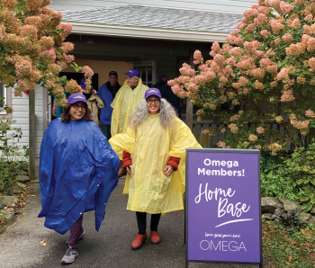 Omega members dressed for a rainy day