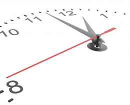 Close-up of a minimalist wall clock showing time passing, symbolizing slowing down, mindfulness, and being present in daily life.