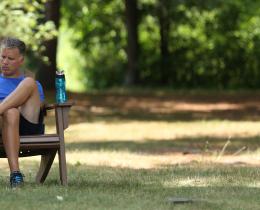 Man writing in chair