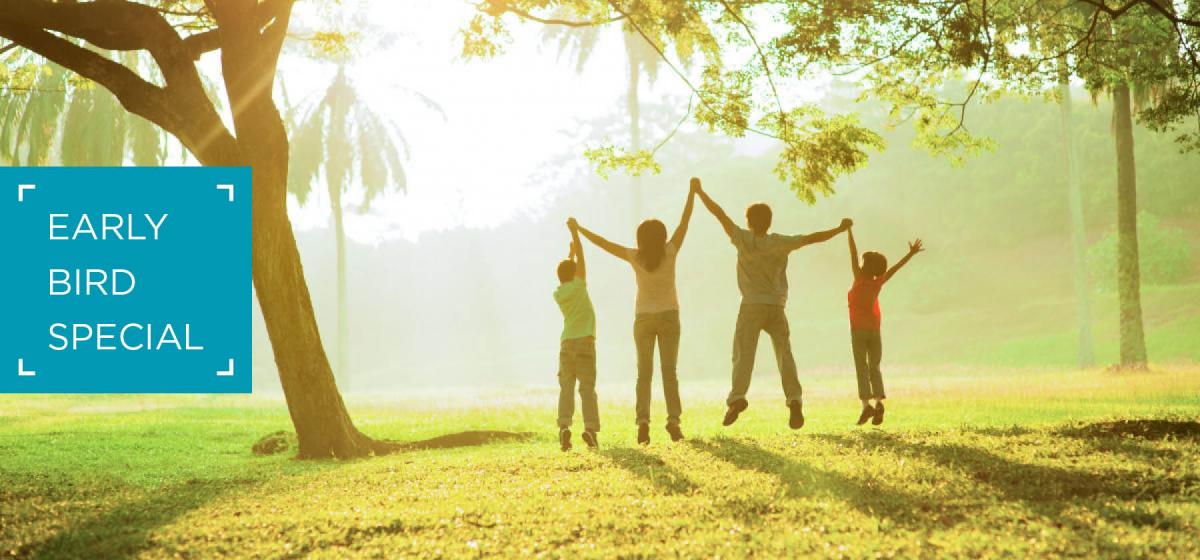 Group of people jumping joyfully in a forest clearing