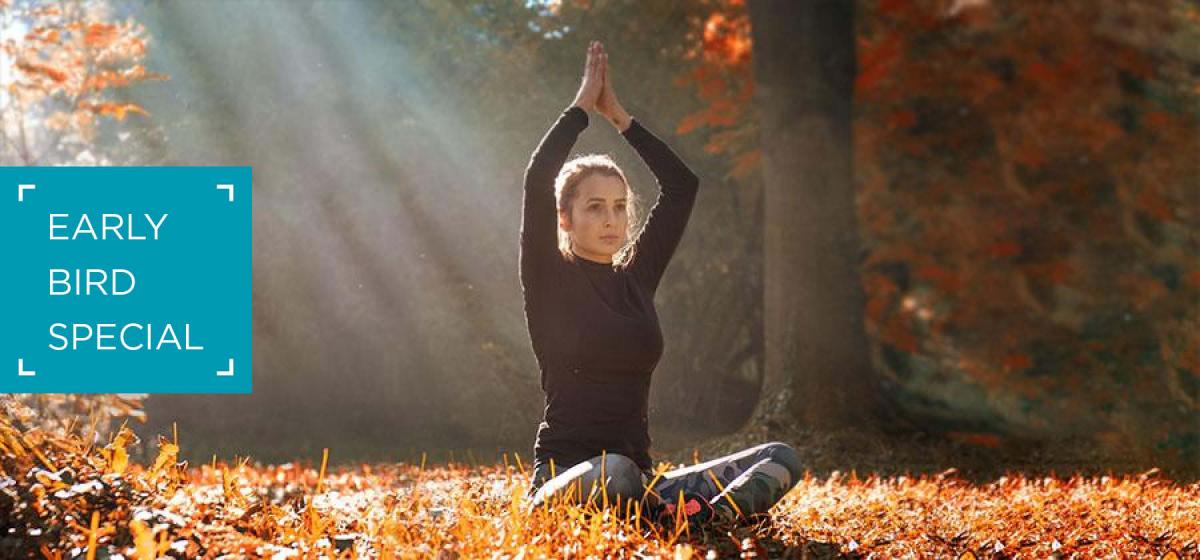 Woman doing yoga in the fall - Early Bird Special