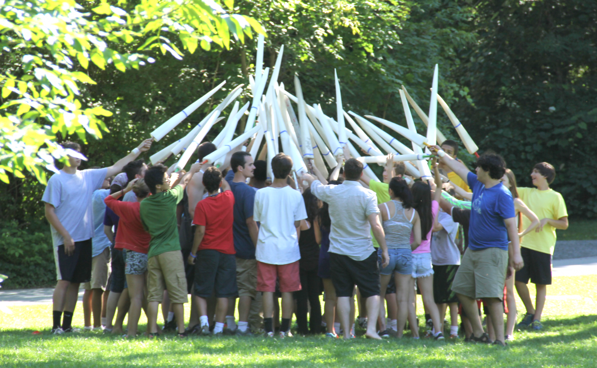 Large group of Wayfinder teens with swords raised