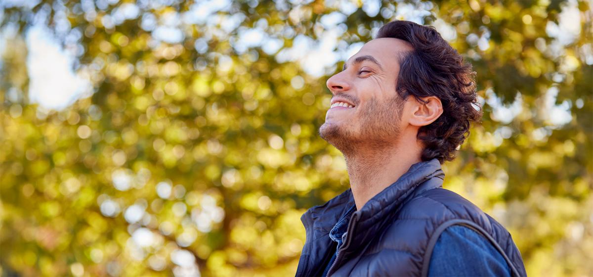 Man breathing deeply and meditating