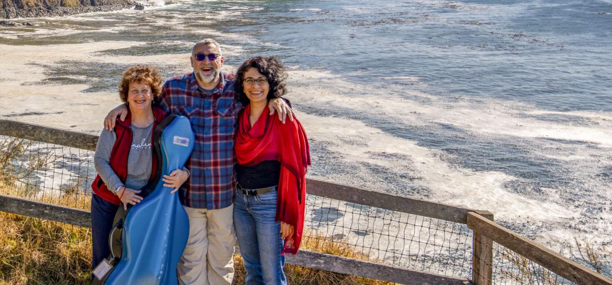 Buddha, Brain & Bach faculty standing by the sea