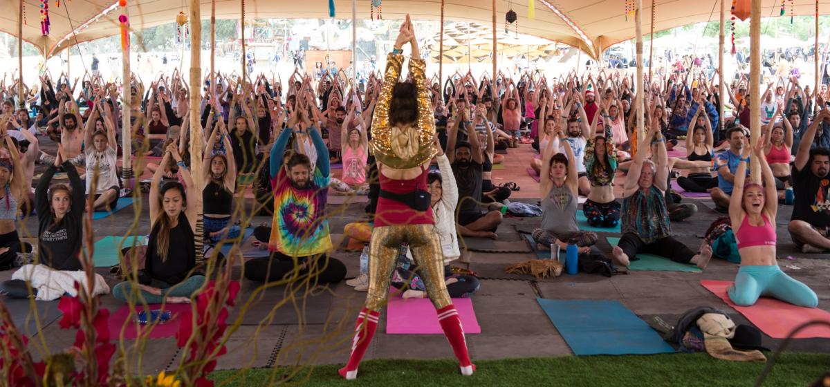 Person leading an energetic yoga class