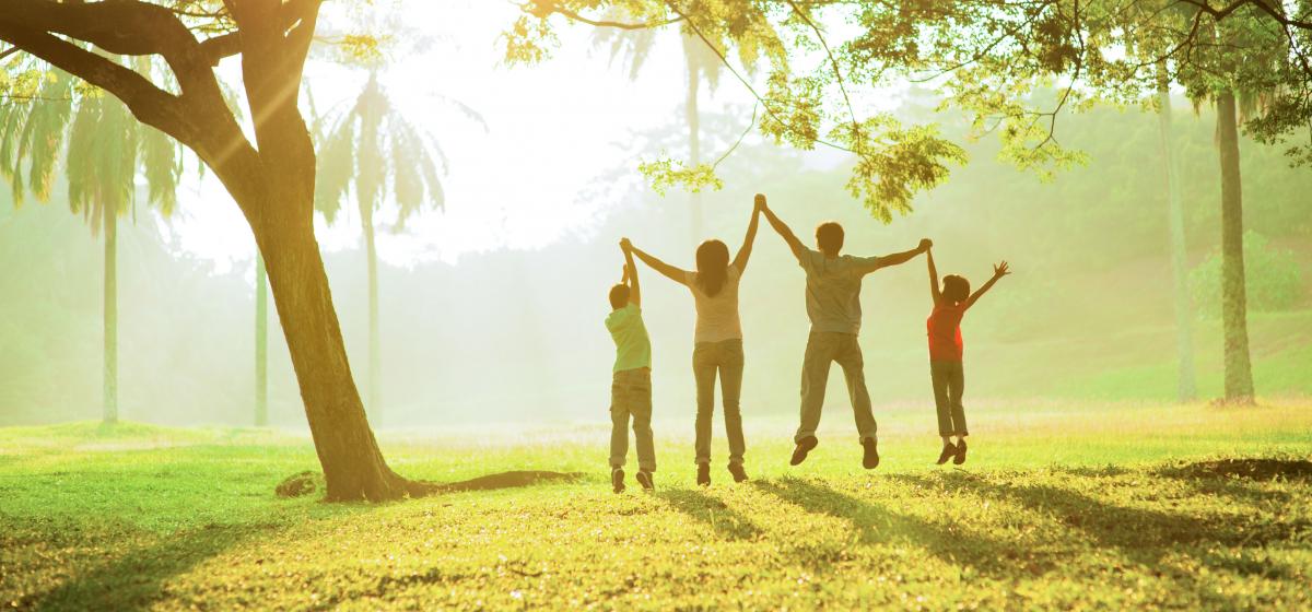 Group of people jumping in a forest