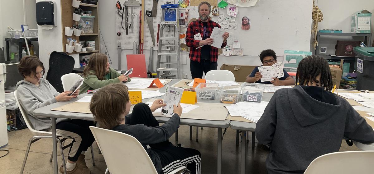 Chris O'Neal leading a cartooning workshop