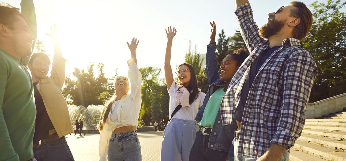 People in a vocal group exercise outside