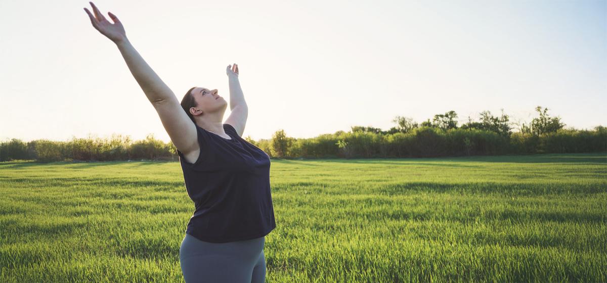 Person with their arms outstretched