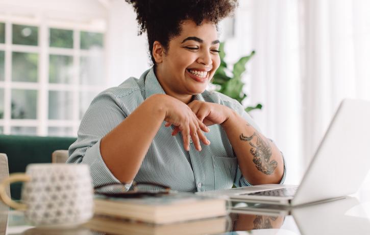 Smiling Woman enjoying an online course